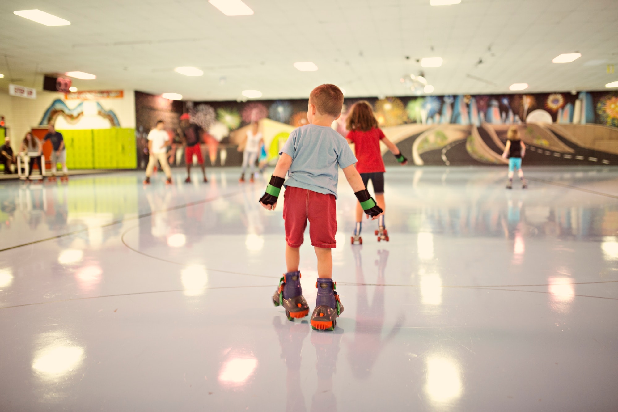Family roller skating at a roller rink